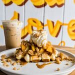 a white plate topped with waffles and ice cream